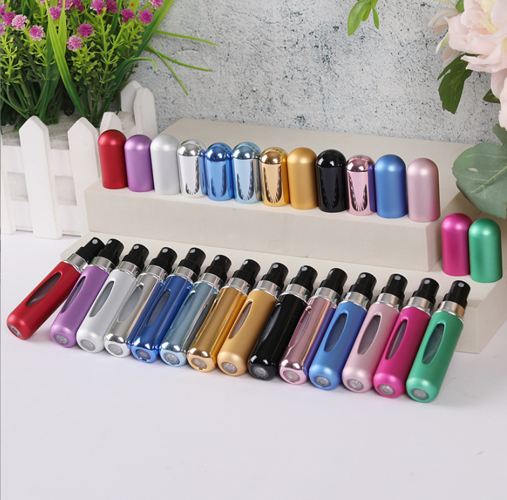 Bottom-filled round-headed mini-pressing spray perfume bottle