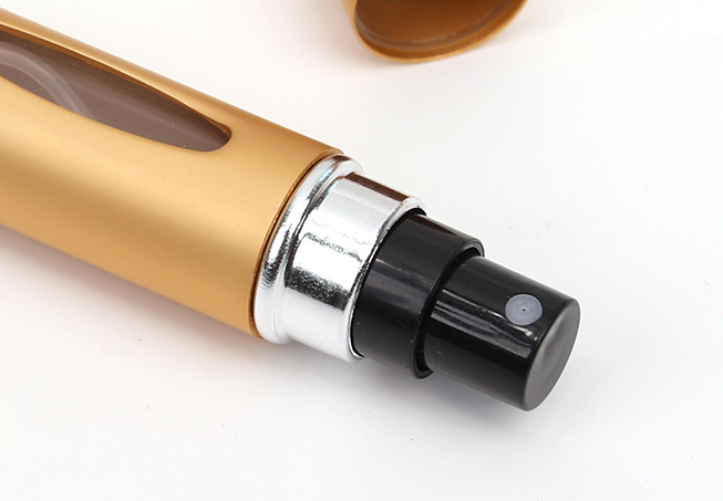 Bottom-filled round-headed mini-pressing spray perfume bottle